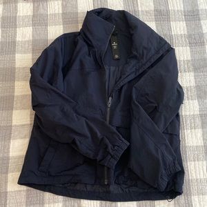 Lululemon cropped womens rain jacket with hidden hood, tons of pockets